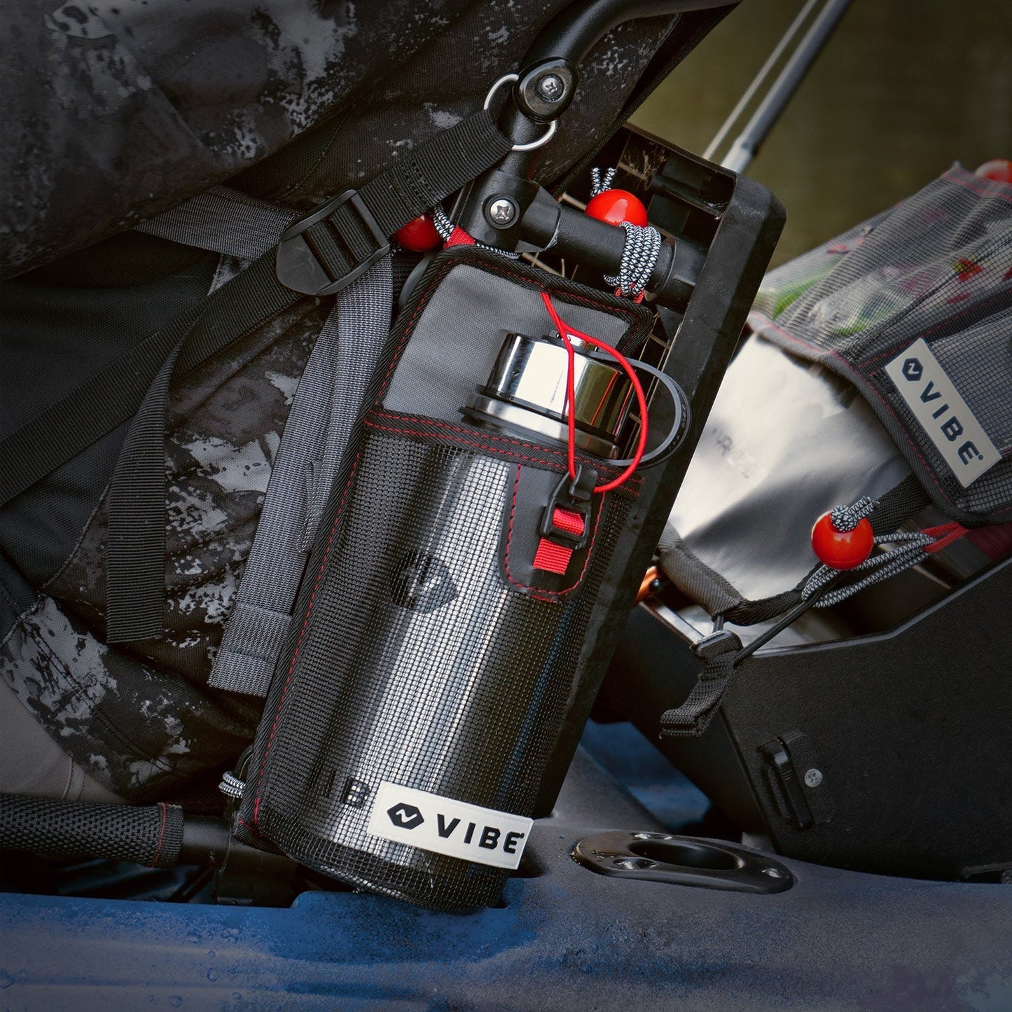 Vibe Kayaks mesh bottle holder with bottle lashed to Hero 2.0 seat with perch