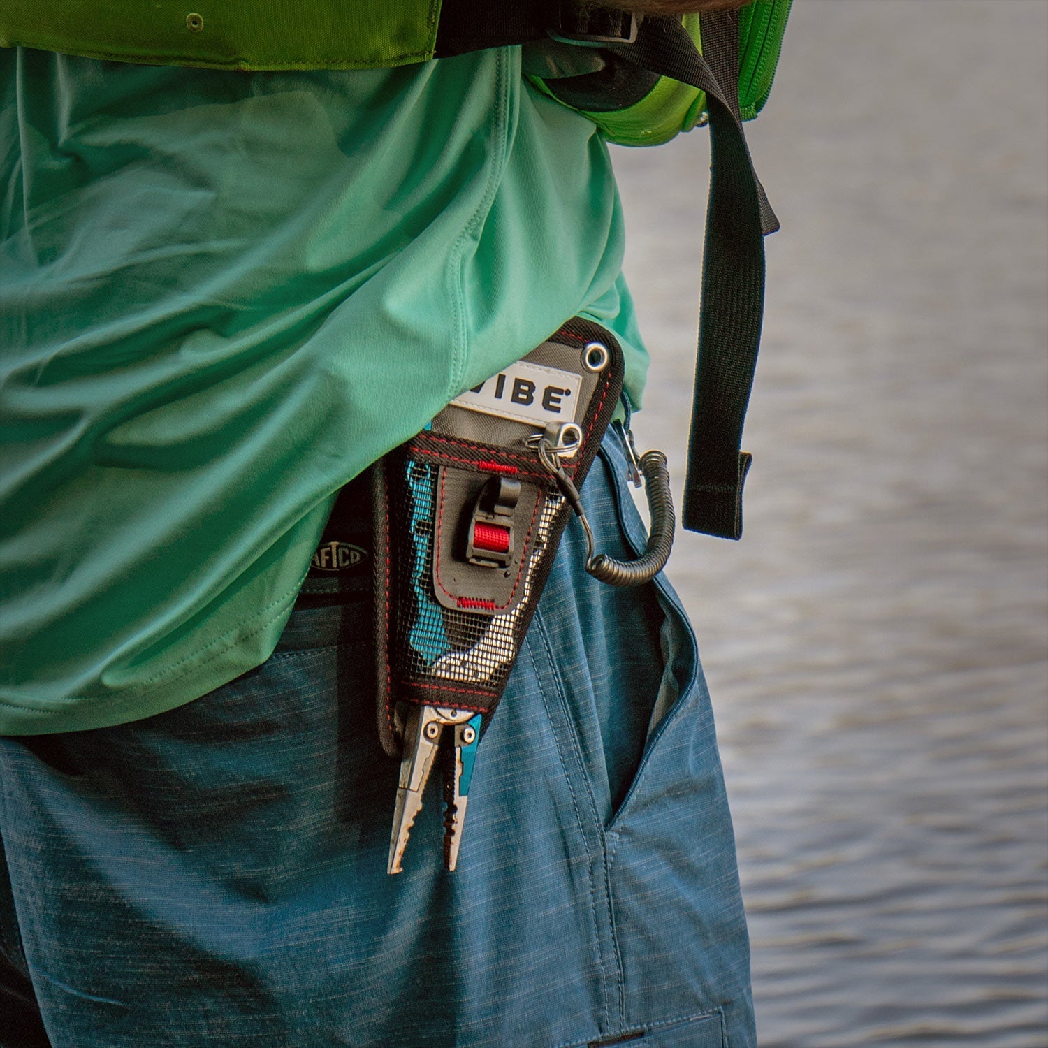 Vibe mesh plier holder on belt holding pliers